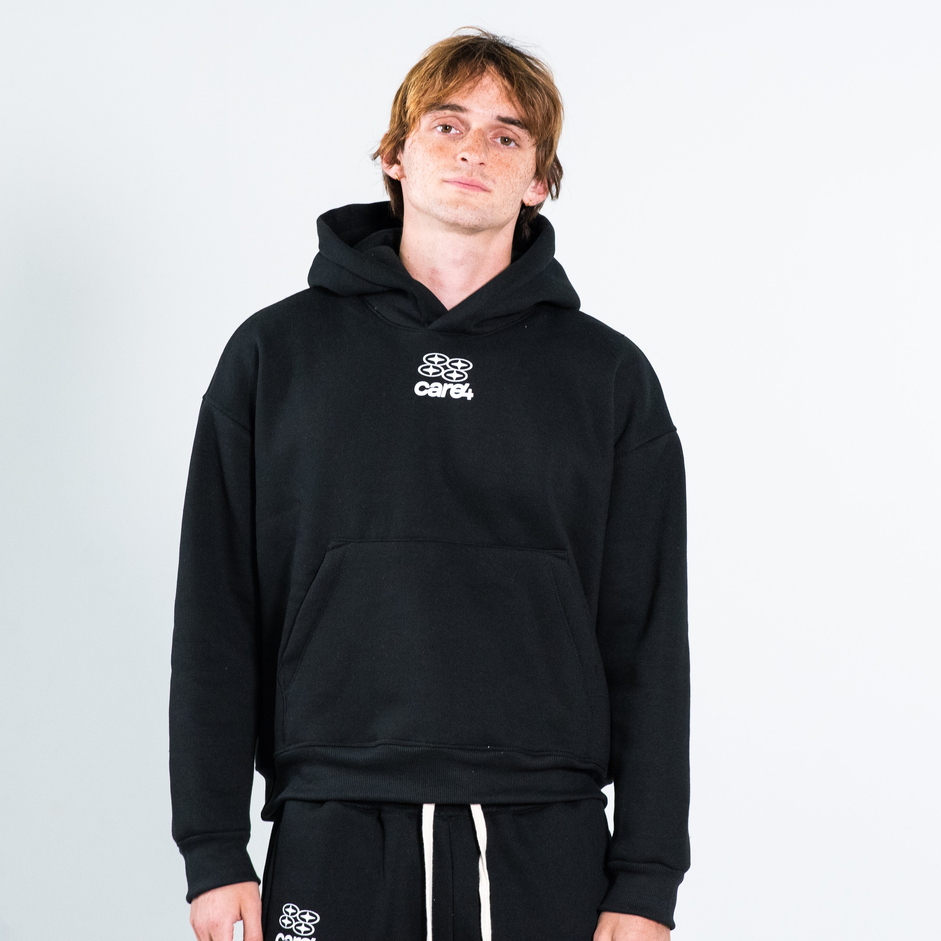 ESSENTIAL BLACK HOODIE – CARE4